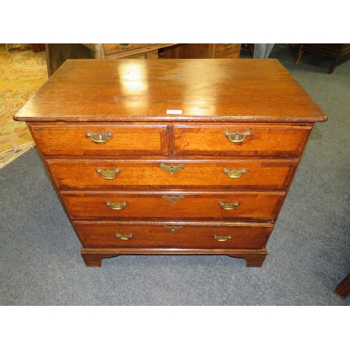 572 - A 19TH CENTURY OAK CROSSBANDED CHEST OF SMALL PROPORTIONS, with two short above three longer graduat... 