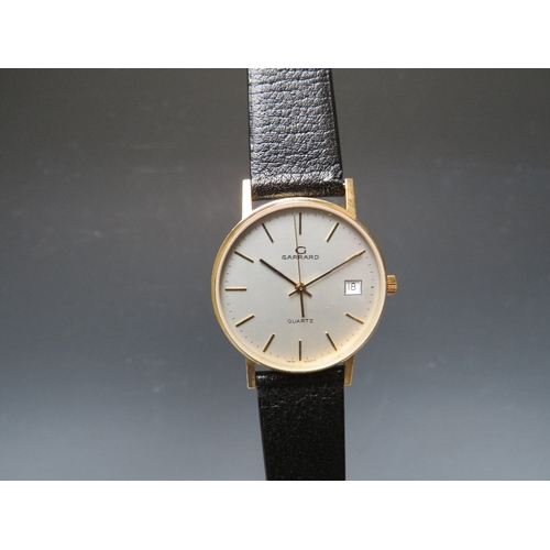 314 - A BOXED GARRARD DATE QUARTZ WRIST WATCH, with certificate of guarantee dated 1992. Dia 3.5 cm