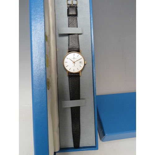 314 - A BOXED GARRARD DATE QUARTZ WRIST WATCH, with certificate of guarantee dated 1992. Dia 3.5 cm