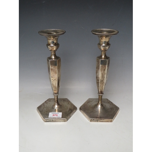 373 - A PAIR OF HALLMARKED SILVER CANDLESTICKS BY HAWKSWORTH EYRE & CO LTD, with Staffordshire Agricultura... 