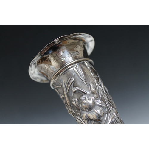 394 - AN ORNATE WILLIAM COMYNS HALLMARKED SILVER VASE - LONDON 1901,having a filled base, H 16 cm, togethe... 