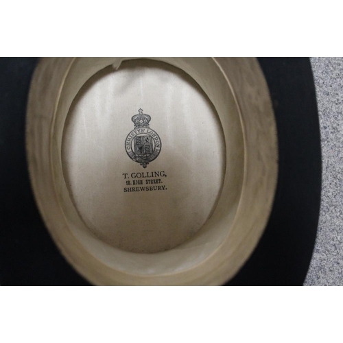 150 - A METAL HAT BOX CONTAINING A CHRISTYS OF LONDON TOP HAT PLUS A HOMBURG TYPE TRILBY