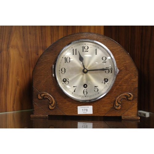 178 - A VINTAGE OAK MANTLE CLOCK