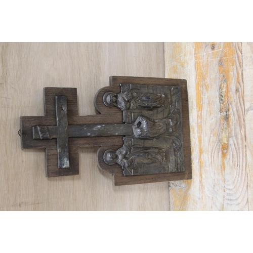 212 - A CAST METAL RELIGIOUS SCENE MOUNTED ON A WOODEN PLAQUE