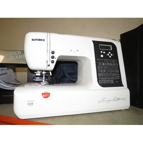 638 - A BUTTERICK ELECTRIC SEWING MACHINE WITH BLUE HOLDALL - HOUSE CLEARANCE