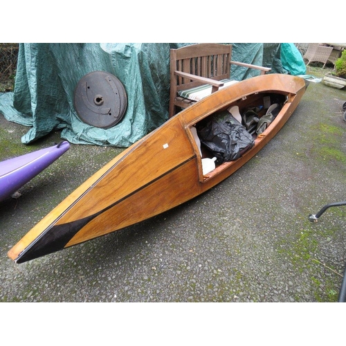 668 - A LARGE VINTAGE WOODEN CANOE