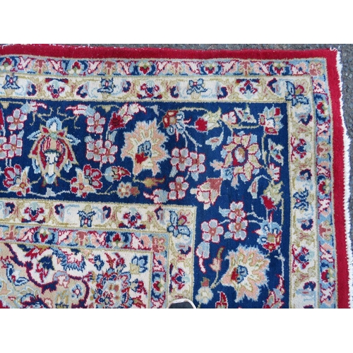 883 - A LARGE RUG, CREAM GROUND WITH RED AND BLUE, APPROX 368 X 270 - WEAR THROUGHOUT