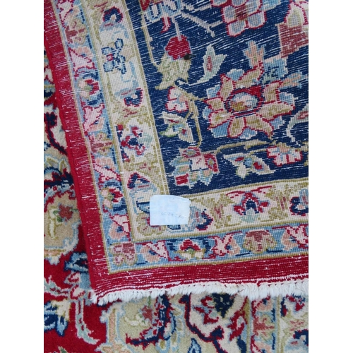 883 - A LARGE RUG, CREAM GROUND WITH RED AND BLUE, APPROX 368 X 270 - WEAR THROUGHOUT