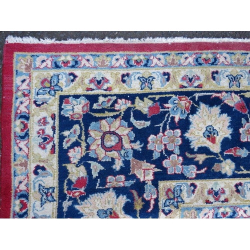 883 - A LARGE RUG, CREAM GROUND WITH RED AND BLUE, APPROX 368 X 270 - WEAR THROUGHOUT