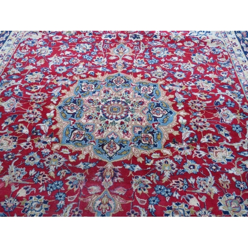 883 - A LARGE RUG, CREAM GROUND WITH RED AND BLUE, APPROX 368 X 270 - WEAR THROUGHOUT