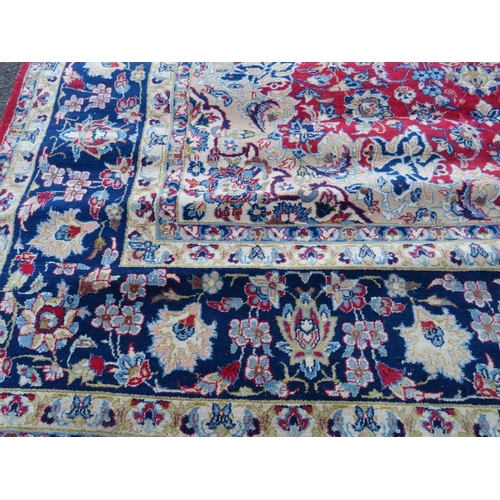 883 - A LARGE RUG, CREAM GROUND WITH RED AND BLUE, APPROX 368 X 270 - WEAR THROUGHOUT