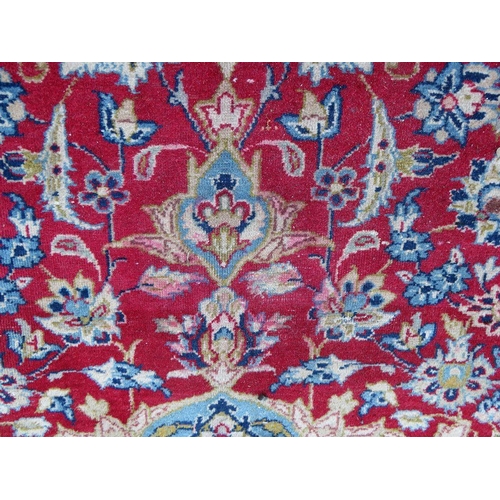 883 - A LARGE RUG, CREAM GROUND WITH RED AND BLUE, APPROX 368 X 270 - WEAR THROUGHOUT