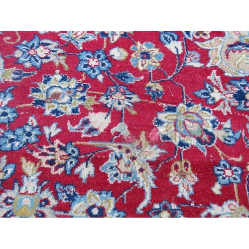 883 - A LARGE RUG, CREAM GROUND WITH RED AND BLUE, APPROX 368 X 270 - WEAR THROUGHOUT