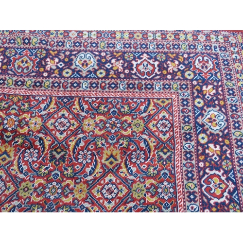 884 - A LARGE CARPET - RUST / TERRACOTTA GROUND WITH NAVY / YELLOW PATTERN, APPROX 365 X 253 CM - WEAR THR... 