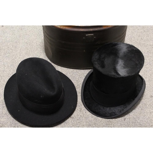 150 - A METAL HAT BOX CONTAINING A CHRISTYS OF LONDON TOP HAT PLUS A HOMBURG TYPE TRILBY