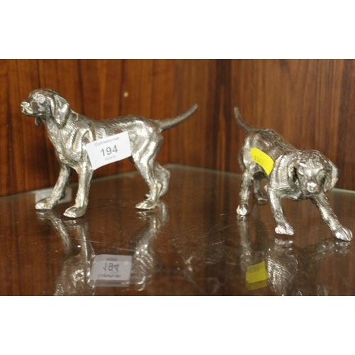 194 - A PAIR OF DECORATIVE CAST METAL DOG FIGURES