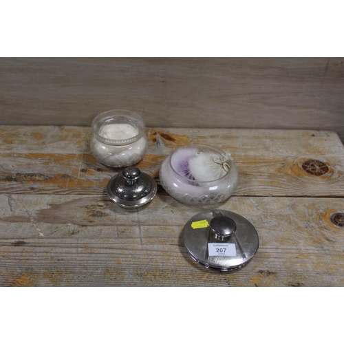 207 - TWO HALLMARKED SILVER TOPPED DRESSING TABLE JARS TO INCLUDE AN ART DECO EXAMPLE