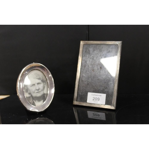 209 - TWO SMALL HALLMARKED SILVER PHOTO FRAMES