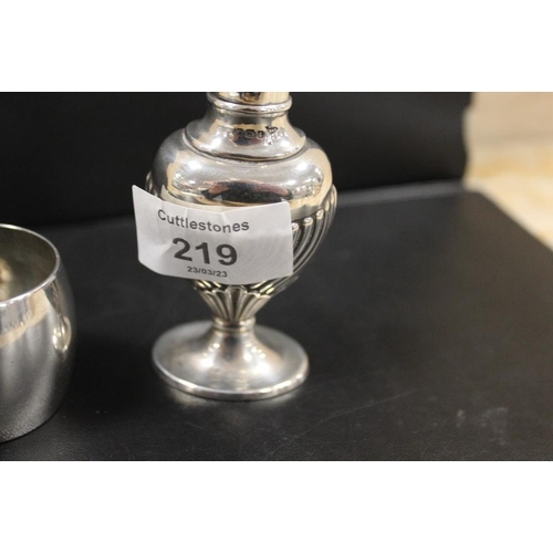 219 - A HALLMARKED SILVER PEPPERETTE TOGETHER WITH A HALLMARKED SILVER NAPKIN RING (2)