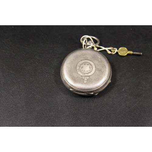 240 - AN ANTIQUE SILVER CASED POCKET WATCH WITH KEY