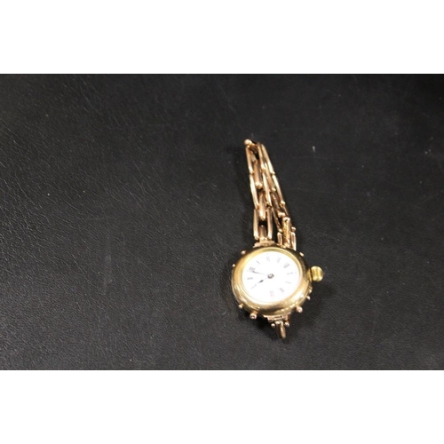 244 - A YELLOW METAL LADIES WRISTWATCH ON EXPANDING BRACELET