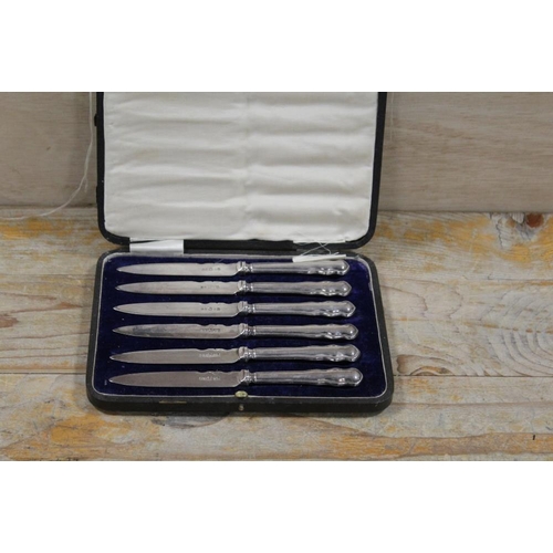 250 - A CASED SET OF HALLMARKED SILVER HANDLED KNIVES