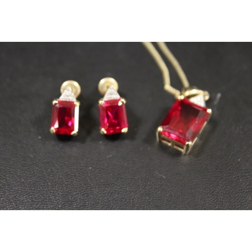 282 - A EMERALD CUT RED STONE HALLMARKED 9CT GOLD PENDANT ON CHAIN STAMPED 375 WITH A MATCHING PAIR OF HAL... 