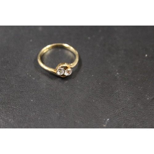 285 - AN 18CT GOLD RING SET WITH TWO WHITE STONES - APPROX WEIGHT 2.4 G