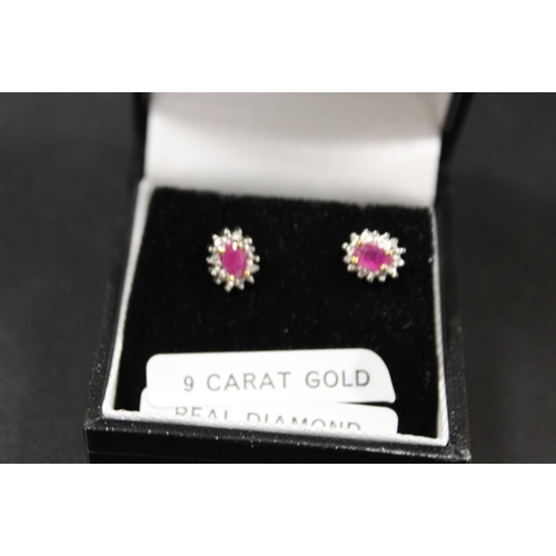 290 - A PAIR OF A RUBY AND DIAMOND SET EARRINGS