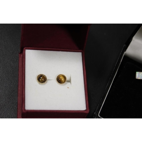 291 - A PAIR OF TIGERS EYE SET STUD EARRINGS TOGETHER WITH TWO PAIRS OF SILVER EARRINGS AND A PAIR OF STUD... 