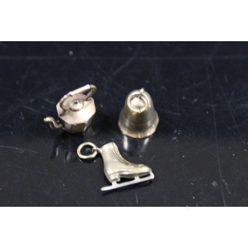 342 - THREE 9CT GOLD CHARMS