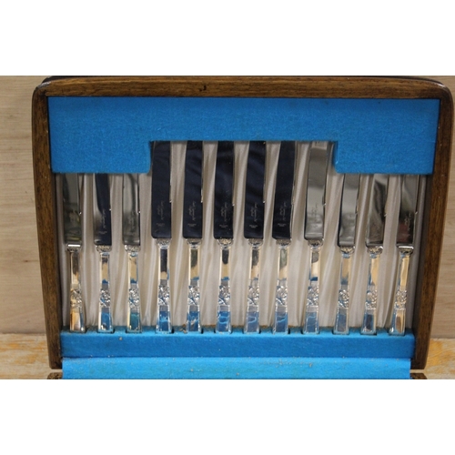 383 - AN OAK CASED CANTEEN OF CUTLERY