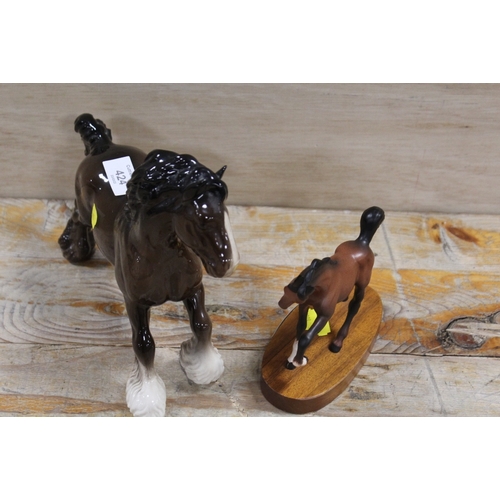 424 - A BESWICK MODEL OF A CANTERING SHORE TOGETHER WITH A BESWICK MODEL OF A FOAL ON A PLINTH (2)