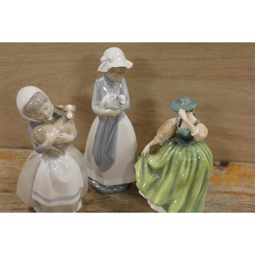 427 - A ROYAL DOULTON FIGURINE BUTTERCUP, TOGETHER WITH TWO NAO FIGURES (3)