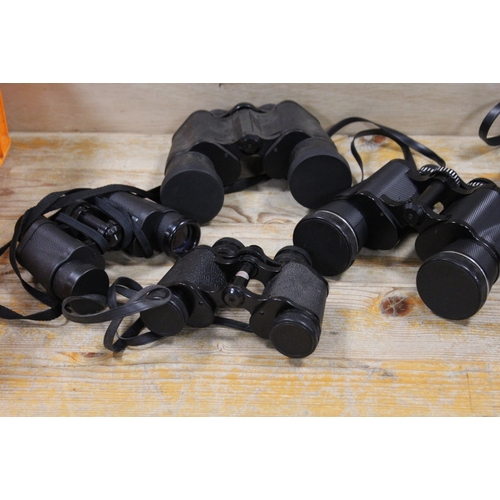 428 - A QUANTITY OF CASED BINOCULARS