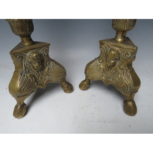 183 - A PAIR OF DECORATIVE BRASS PRICKET CANDLESTICKS, with cherubic mask detail, H 43 cm (2)