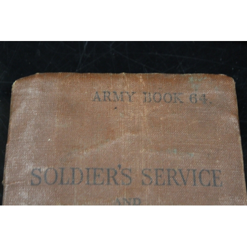 339 - AN ARMY SOLDIERS SERVICE AND PAY BOOK TOGETHER WITH A MEDAL