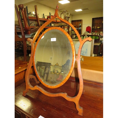 809 - A LATE 19TH CENTURY MAHOGANY DRESSING MIRROR, the oval mirror supported on a shaped framed, H 76 cm