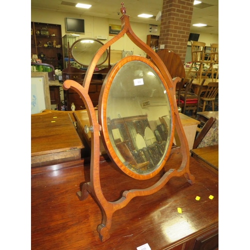 809 - A LATE 19TH CENTURY MAHOGANY DRESSING MIRROR, the oval mirror supported on a shaped framed, H 76 cm