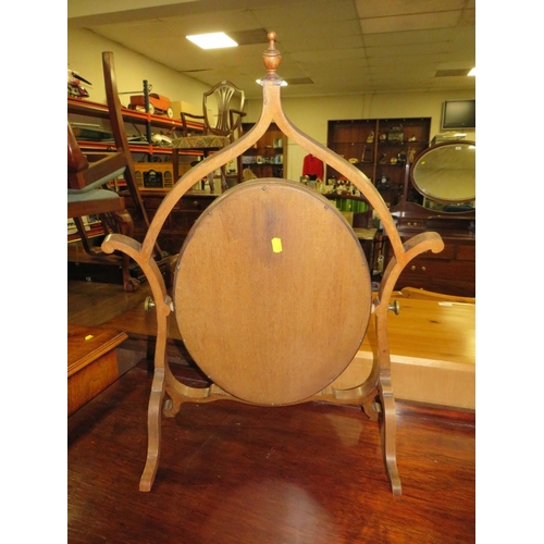 809 - A LATE 19TH CENTURY MAHOGANY DRESSING MIRROR, the oval mirror supported on a shaped framed, H 76 cm