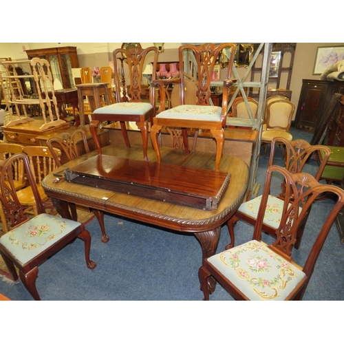 812 - A LARGE EARLY 20TH CENTURY MAHOGANY SIDEBOARD, WIND-OUT DINING TABLE AND 7 CHAIRS ON BALL AND CLAW F... 