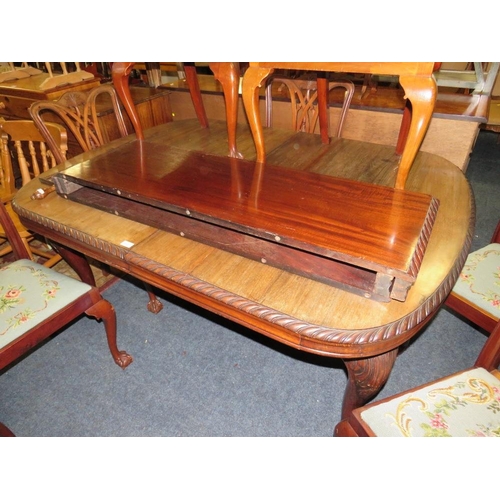 812 - A LARGE EARLY 20TH CENTURY MAHOGANY SIDEBOARD, WIND-OUT DINING TABLE AND 7 CHAIRS ON BALL AND CLAW F... 