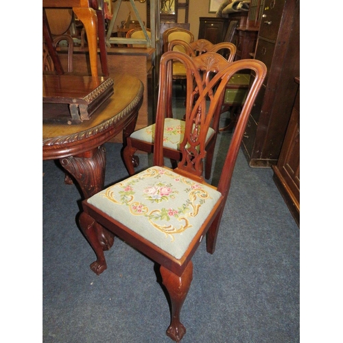 812 - A LARGE EARLY 20TH CENTURY MAHOGANY SIDEBOARD, WIND-OUT DINING TABLE AND 7 CHAIRS ON BALL AND CLAW F... 