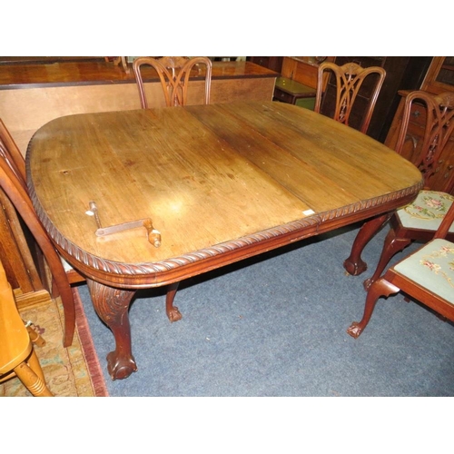 812 - A LARGE EARLY 20TH CENTURY MAHOGANY SIDEBOARD, WIND-OUT DINING TABLE AND 7 CHAIRS ON BALL AND CLAW F... 