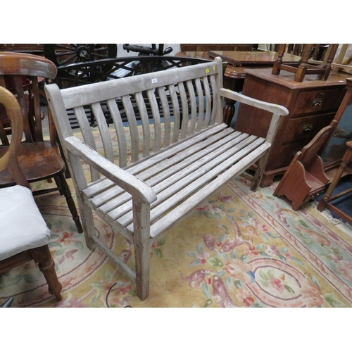 824 - A HARDWOOD GARDEN BENCH