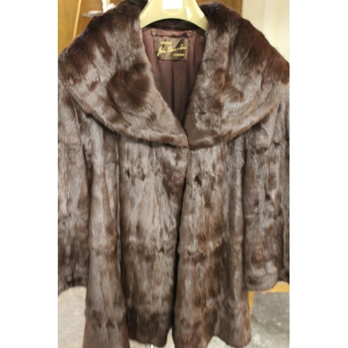 57 - TWO VINTAGE FUR COATS COMPRISING A SWING STYLE BY JOHN DUNN & SONS OF DORKING AND SHORT BOLERO STYLE... 