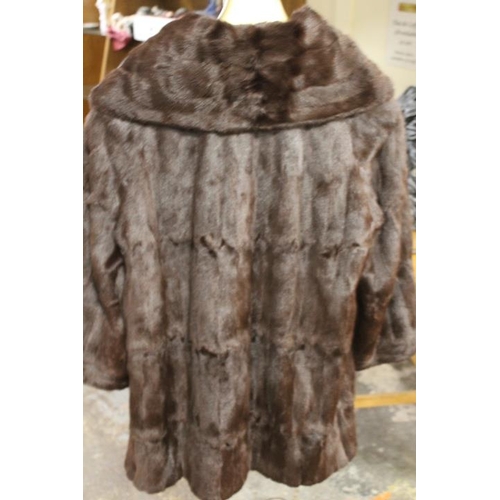 57 - TWO VINTAGE FUR COATS COMPRISING A SWING STYLE BY JOHN DUNN & SONS OF DORKING AND SHORT BOLERO STYLE... 