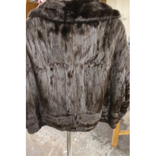 57 - TWO VINTAGE FUR COATS COMPRISING A SWING STYLE BY JOHN DUNN & SONS OF DORKING AND SHORT BOLERO STYLE... 