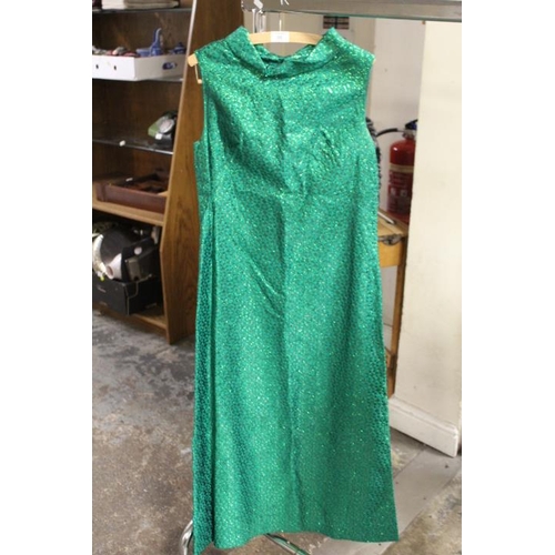 59 - A VINTAGE BLACK VELVET CAPE WITH CONTRASTING RED LINING, TOGETHER WITH A VINTAGE GREEN LUREX EVENING... 