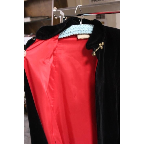 59 - A VINTAGE BLACK VELVET CAPE WITH CONTRASTING RED LINING, TOGETHER WITH A VINTAGE GREEN LUREX EVENING... 